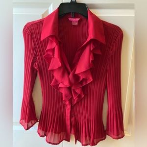 Red ruffed polyester blouse, Size petite medium. Brand Sunny Leigh.